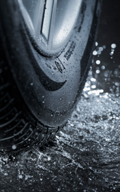 Car tire on rainy roads