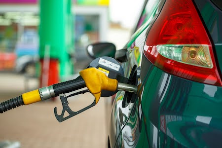 Car refueling on a petrol station closeup